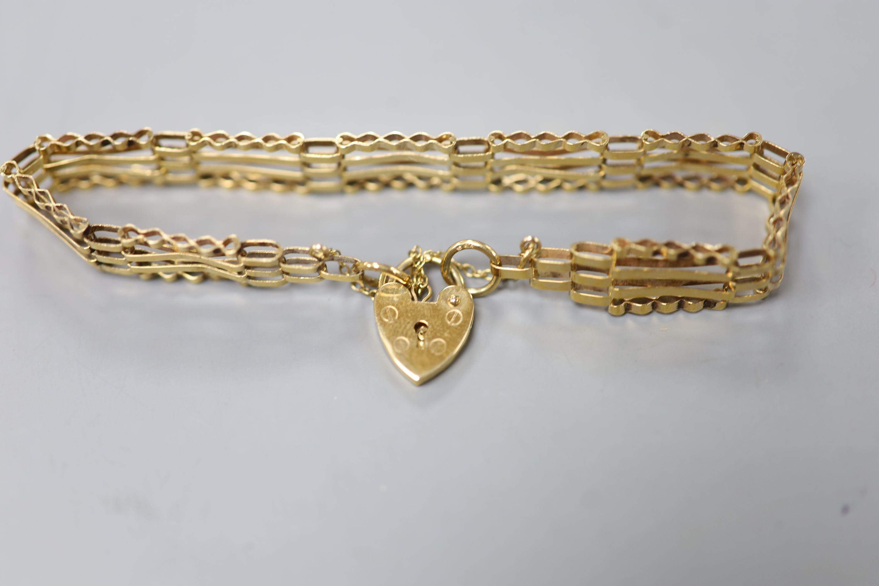 Three assorted modern 9ct gold bracelets, including charm and ropetwist